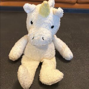 Thermal-Aid cream and Yellow Stuffed Unicorn Toy
